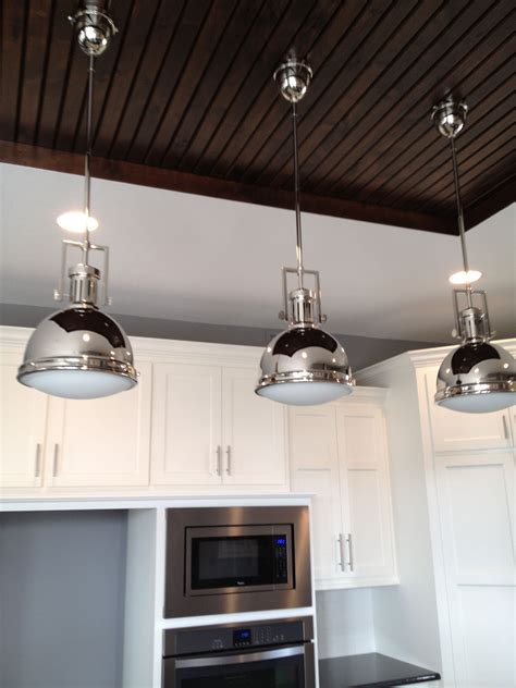 Pendulum Light Over A Kitchen Island Beadboard Ceiling Over Kitchen