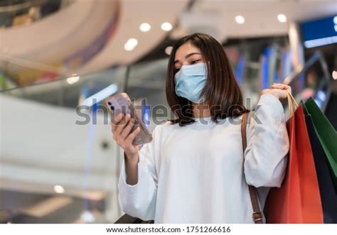 Young Woman Using Smartphone Shopping Mall Stock Photo 1751266616