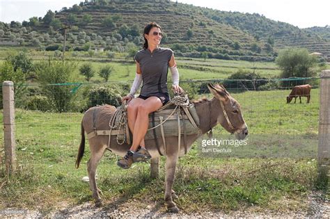 Woman Riding Donkey Riding Donkey Photo