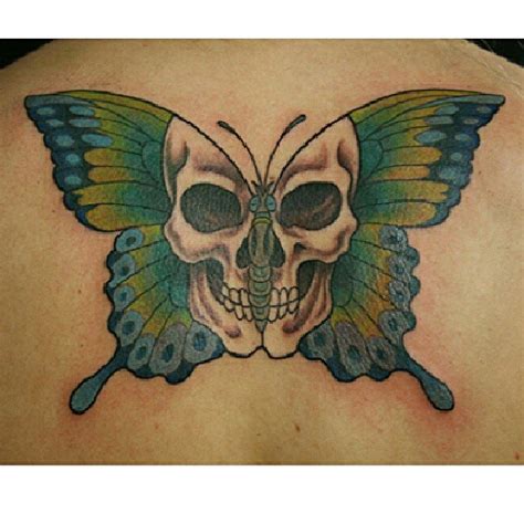 Butterfly Tattoo With Skull On Back Body