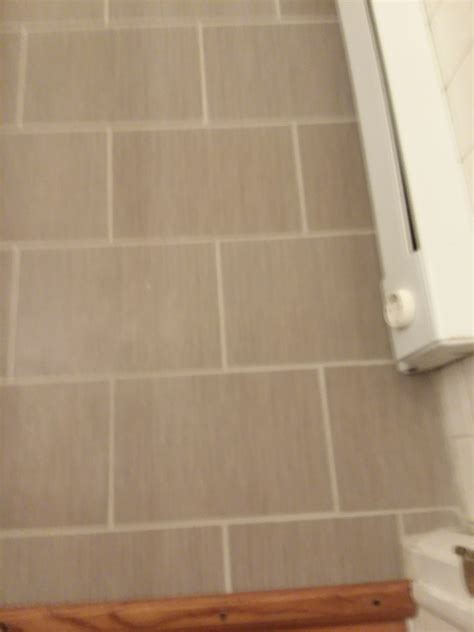 Its fairly normal practice to install a tile one day the grout the next. Day after grouting.... | Bathroom flooring, Flooring, Tiles