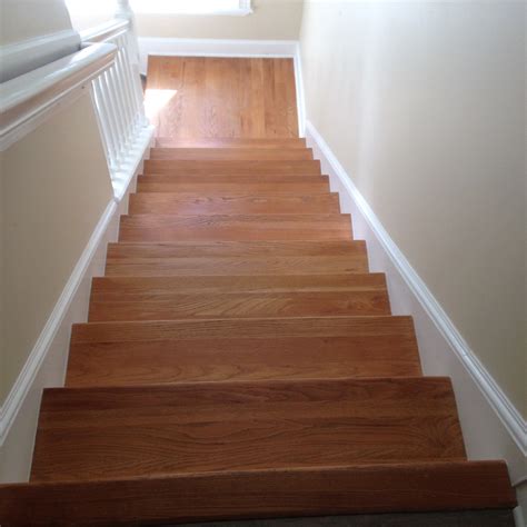 Sand the treads with 60 grit sand paper with the orbital sander, this will take the wood down to the raw finish. wood floor sand and stain Archives - Dan's Floor Store