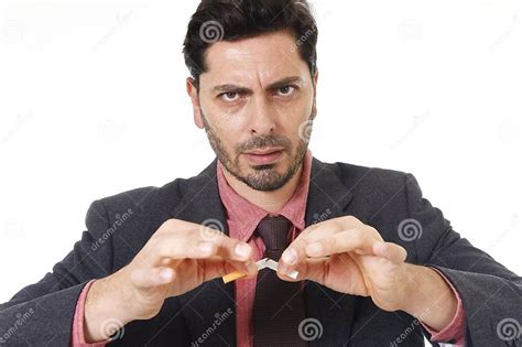 Young Hispanic Attractive Man Breaking Cigarette In Quit Smoking