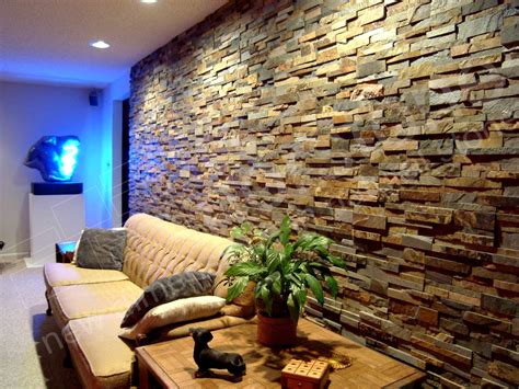 A Living Room Filled With Furniture And A Stone Wall Behind The Couch