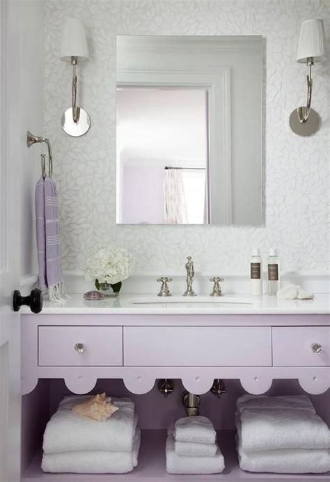 A white vanity and neutral wall trim prevent the hue from becoming too heavy. Romantic Bathroom With A Lavender Vanity And White Stone Countertop in 2020 | Purple bathrooms ...