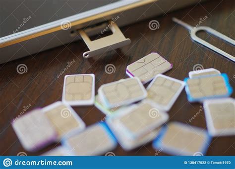 Many Sim Cards To Choose With A Smart Phone Stock Photo Image Of Desk