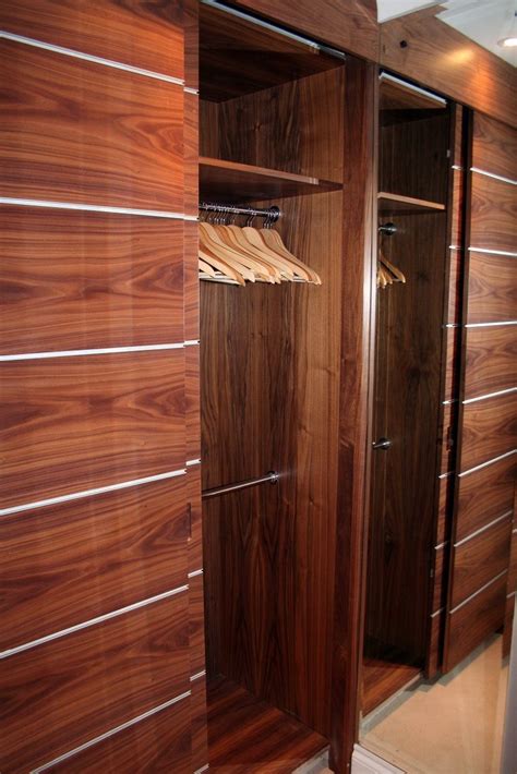Walnut Veneer Wardrobe With Aluminium Inlays And Sliding Doors