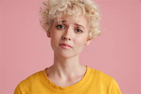 Portrait Of A Young Blonde Girl With Curly Blonde Hair Stock Image