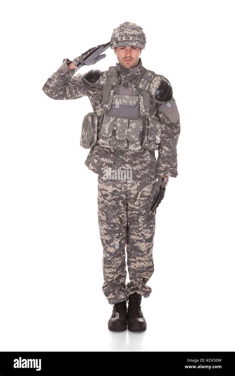 Man In Military Uniform Saluting Over White Background Stock Photo Alamy