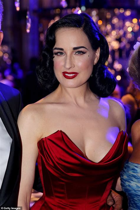 Dita Von Teese Oozes Glamour In A Plunging Scarlet Gown