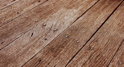 Closeup Photo Of Some Old Rough Wooden Floor Boards Background Texture