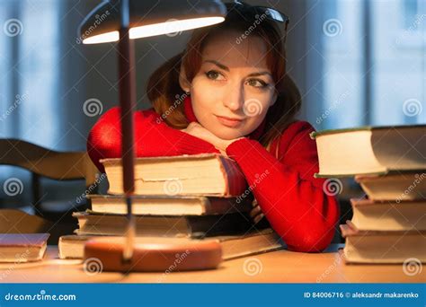 Girl Reading A Book In The Library Under The Lamp Stock Photo Image