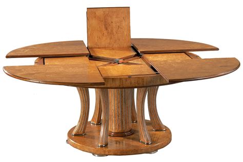 The product is grandly styled; The Great Expanding Round Dining Table - HomesFeed