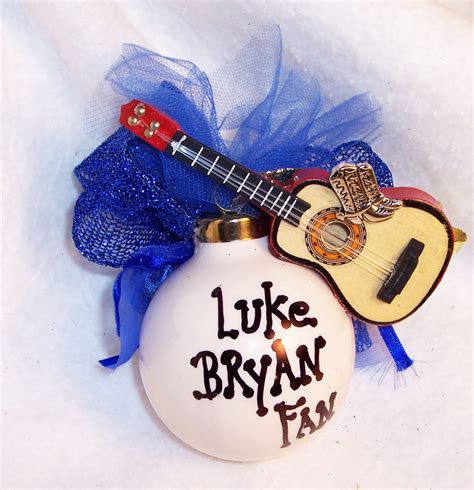 Christmas wreaths create a special atmosphere. Guitar Christmas ornament (With images) | Christmas ...