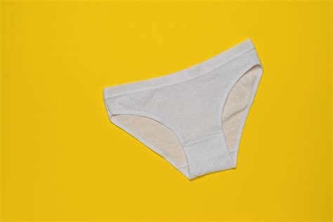Premium Photo White Womens Panties For Teenagers On A Yellow