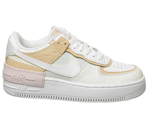 The nike swooshes are sitting on top of each other, while the exaggarated stacked midsole features an 'air' tab to the side. Nike Air Force 1 Shadow Trainers Spruce Aura White Sail ...
