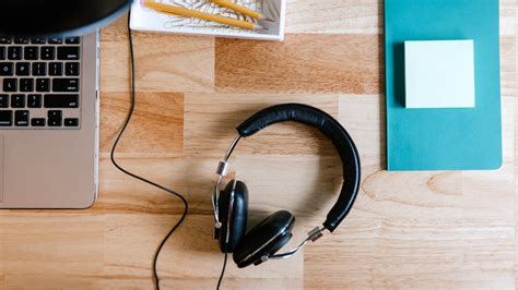 The 20 Best Podcasts To Listen To At Work
