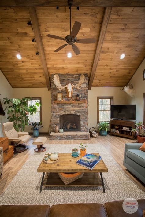 Get Cozy In This Rustic Living Room With Wood Vaulted Ceiling And Stone