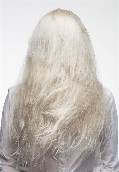 A Blonde Woman With Hair All Over Her Face By Stocksy Contributor