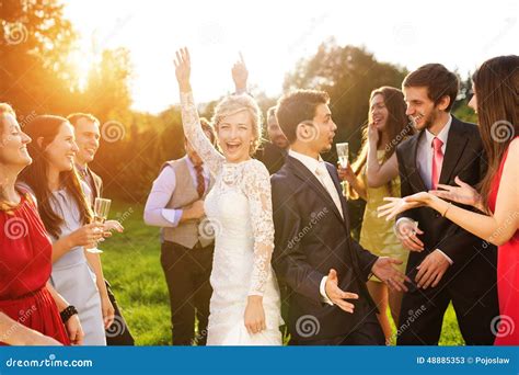 Newlyweds With Guest On Their Garden Party Stock Image Image Of Group