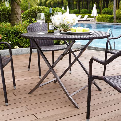 Those designed for the beach or camping might collapse inward, but those meant for guests at an event might fold up flat. Crosley Palm Harbor Outdoor Wicker Folding Table - Patio ...