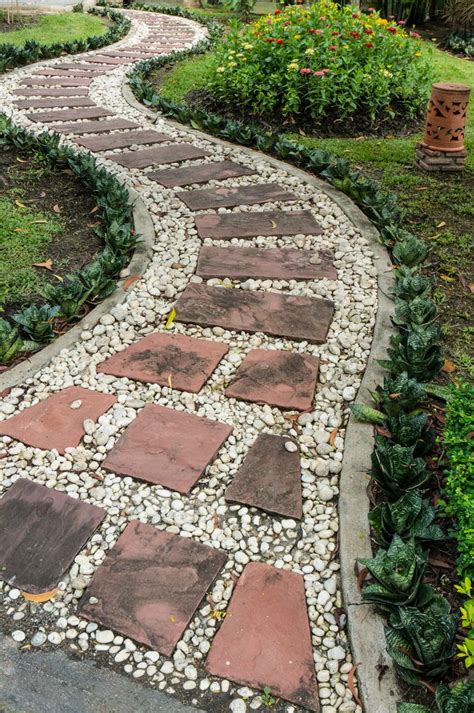 White Pebble Walkway Features Red Flagstone Steps Surrounded By