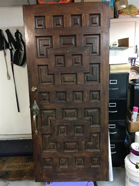 antique wood front door  geometric panels  antique furniture