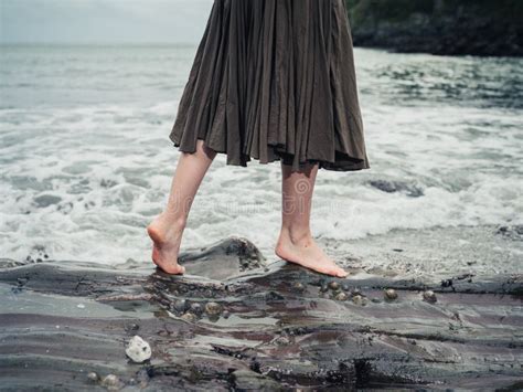 Feet Of Young Woman Walking On Rocks In Water Stock Image Image Of