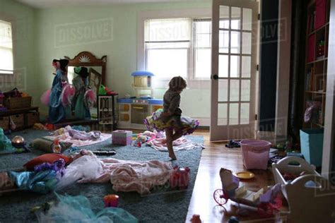 Girl Dancing In Messy Room At Home Stock Photo Dissolve