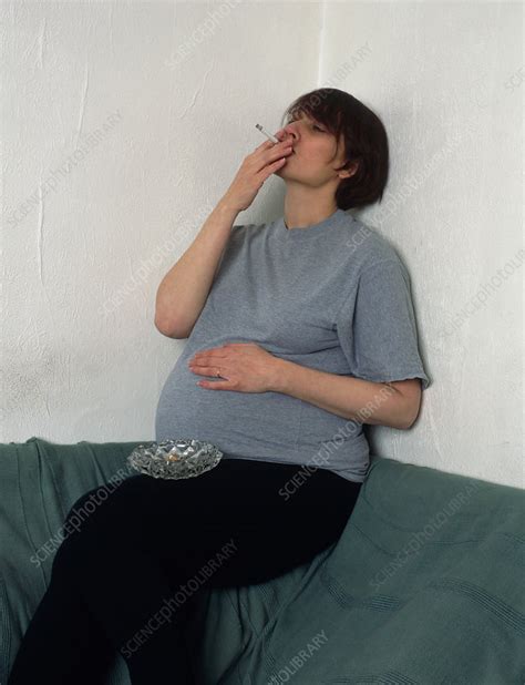 Pregnant Woman Smoking A Cigarette Indoors Stock Image M8050426 Science Photo Library