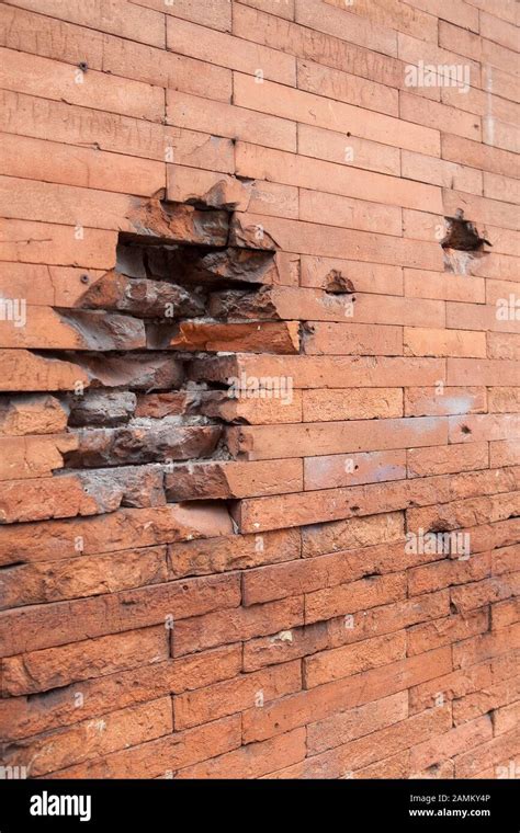Bullet Holes In Brick Wall
