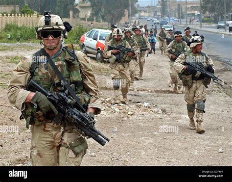Dpa Us Soldiers Patrol On A Street In The Northern Iraqi Town Of