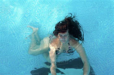 Caucasian Woman Swimming In Pool Stock Photo Dissolve