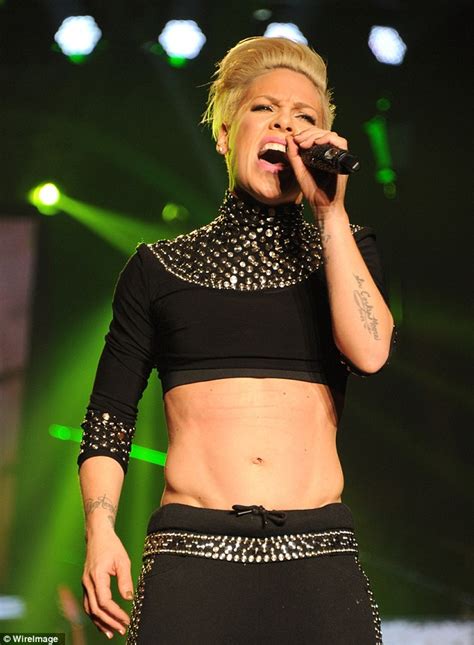 pink shows off her six pack and pelvic v muscle in crop top at madison square garden concert