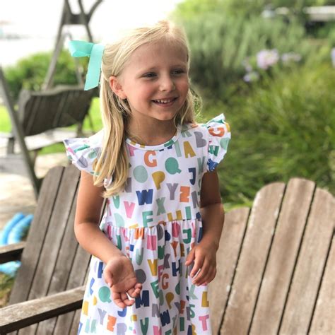Girls stylish cotton poplin dress by italian luxury brand, fendi, printed with the brand's colourful alphabet print. Alphabet Dress - Stitchy Fish | Dresses, Short sleeve ...