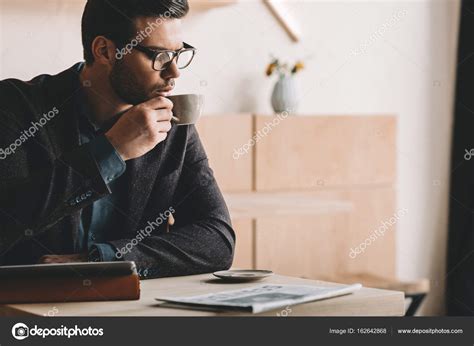 Businessman Drinking Coffee — Stock Photo © Alexlipa 162642868