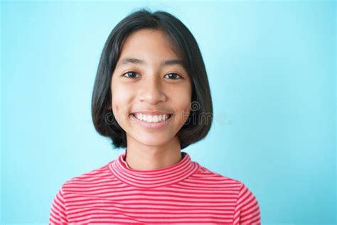 Happy Asian Girl Smile On The Face Blue Background Isolated Portrait