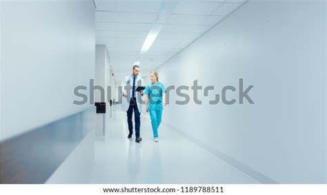 Surgeon Female Doctor Walk Through Hospital Stock Photo 1189788511