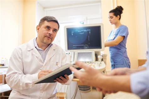 Ultrasound Specialist Talking To Patient Stock Photo Image Of People