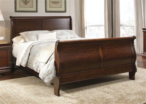 A sleigh bedroom set features a sleigh bed and additional coordinating furnishings like additional simple seating or storage solution furniture. Liberty Furniture Carriage Court Queen Sleigh Bed - Hudson ...