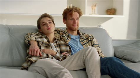 Premium Stock Video Sleepy Couple Watching Tv Together Ginger Man