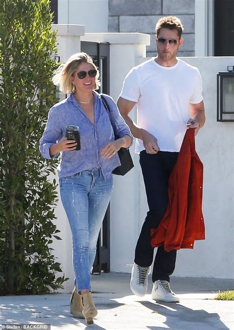The house sits on 1/3 of an acre in the hollywood hills. Justin Hartley leaves his house with a female friend ...