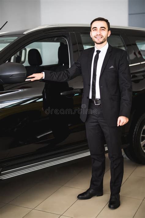 Handsome Young Businessman In Suit Standing Near Car Stock Image