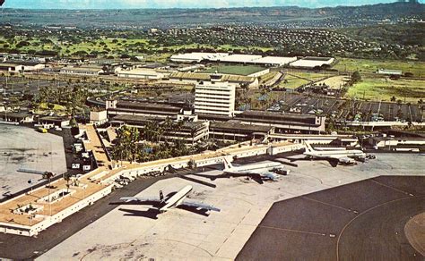 An Aerial View Of The Airport With Planes Parked On The Tarmac And