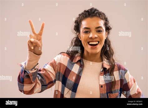 Beautiful Woman Gesturing Peace Sign Hi Res Stock Photography And