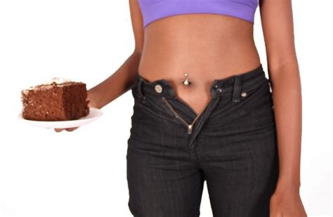 Womans Waistline Expanding After Eating Cake