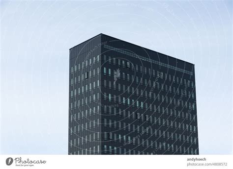 Minimalist Modern High Rise Building With Clear Blue Sky A Royalty