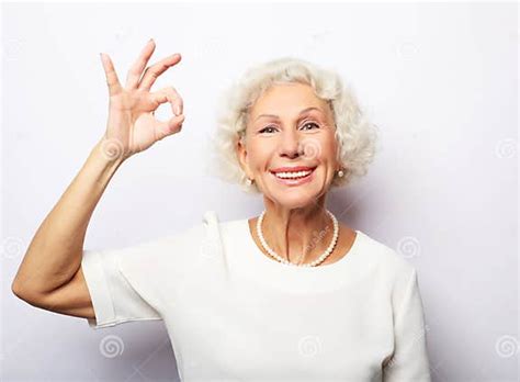 mature lady grandmother granny grandma she is showing okay sign stock image image of person