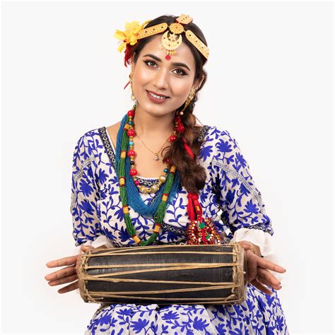 nepali girl playing madal during tihar festival in traditional attire photos nepal
