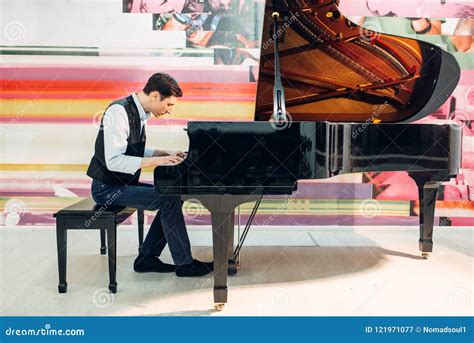 Male Pianist Practicing Composition On Grand Piano Stock Image Image